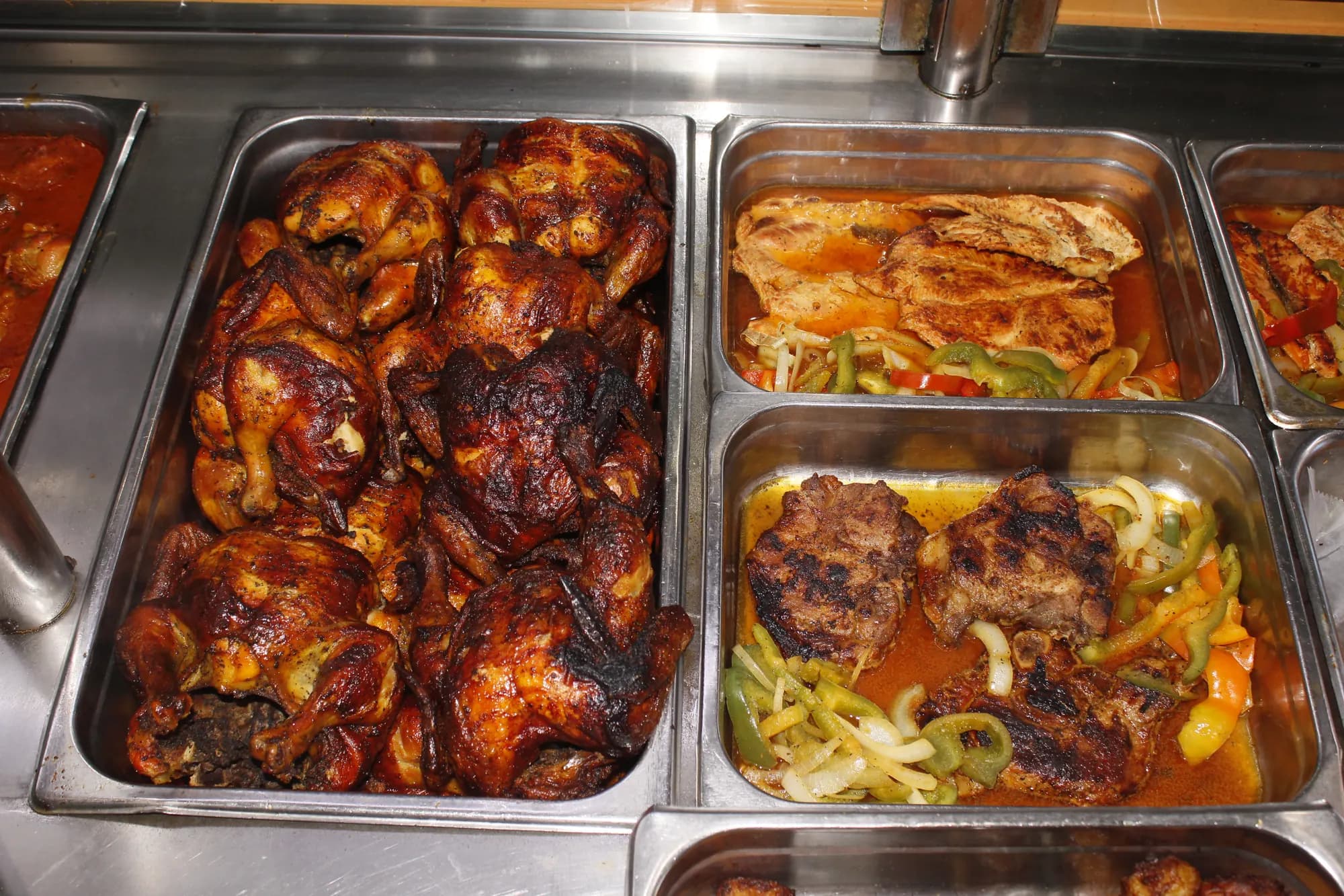 Rotisserie chickens, sautéed chicken and burgers in the hot case