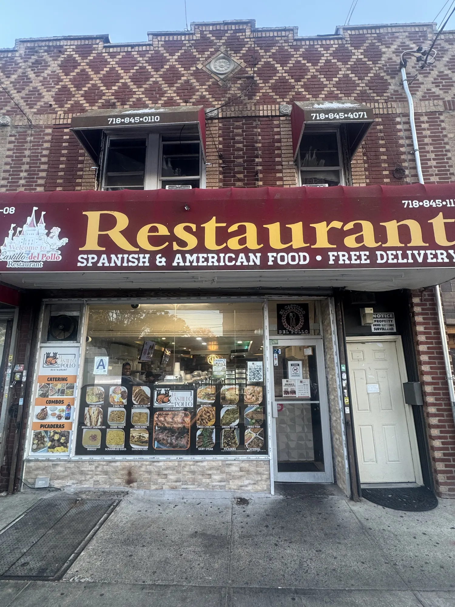 Looking up at the awning: Spanish and American food, free delivery